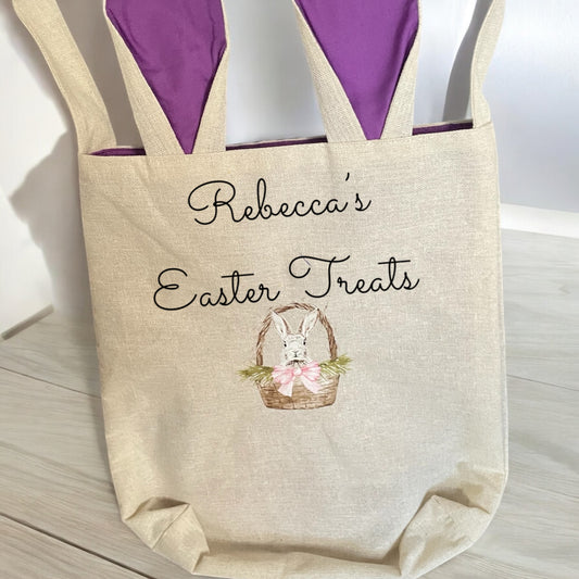 A large fabric Easter bag with 'Rebecca's Easter Treats' printed on it, featuring a picture of a bunny and a basket with eggs.