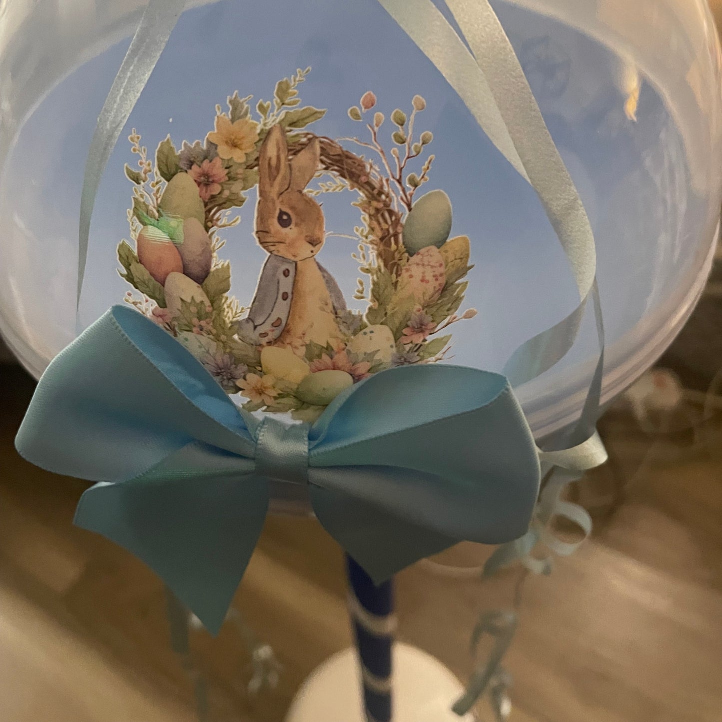 Decorative wreath with a rabbit and flowers on a clear background
