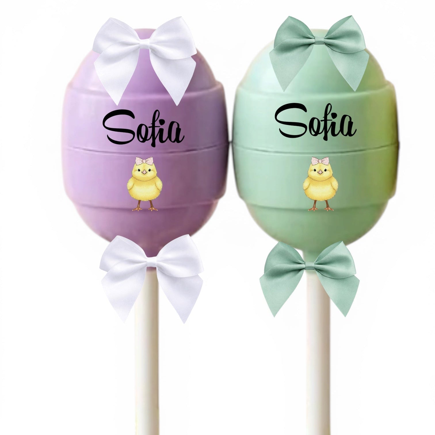 Two decorative items shaped like eggs with bows and names on a white background