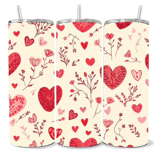 Three tumblers with red heart and floral pattern on a white background
