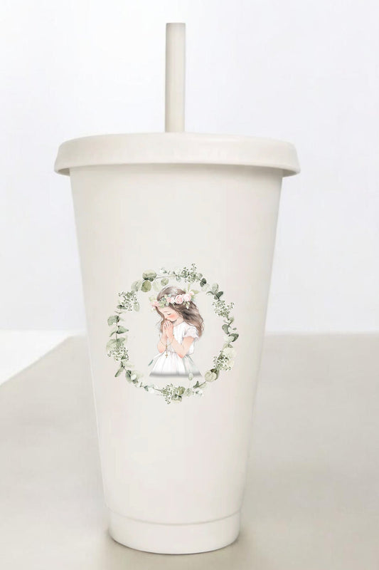 White tumbler with a floral design and a straw on a white background