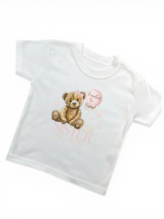 White t-shirt with teddy bear and text design on a white background