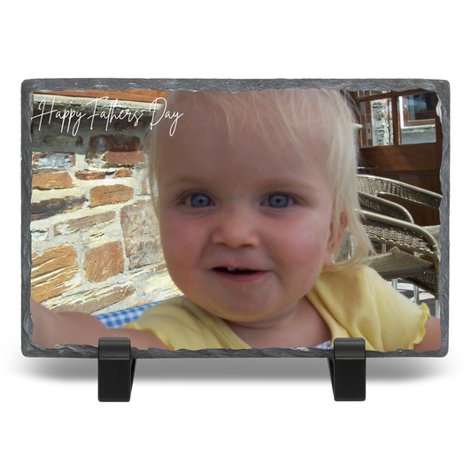 Personalized photo plaque with a child's face and 'Happy Father's Day' text on a stone background.
